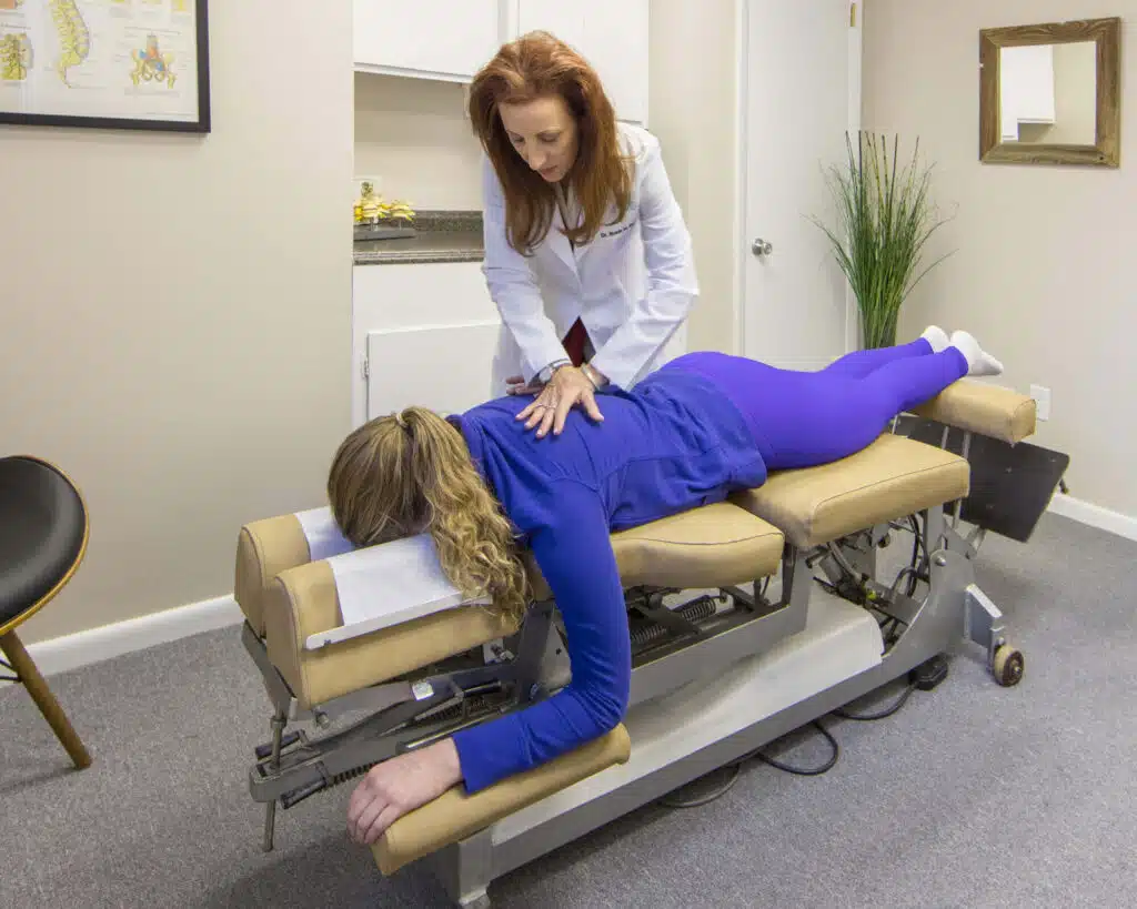 chiropractor working on patient